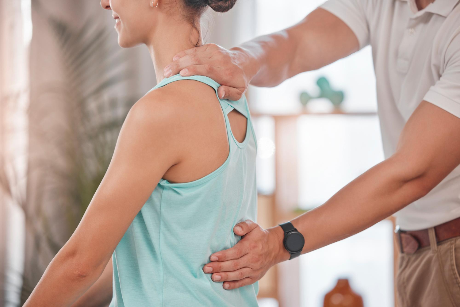 chiropractor-consultation-woman-physical-therapy-her-back-pain-muscle-stress-body-performance-physiotherapy-support-athlete-with-physiotherapist-help-with-rehabilitation