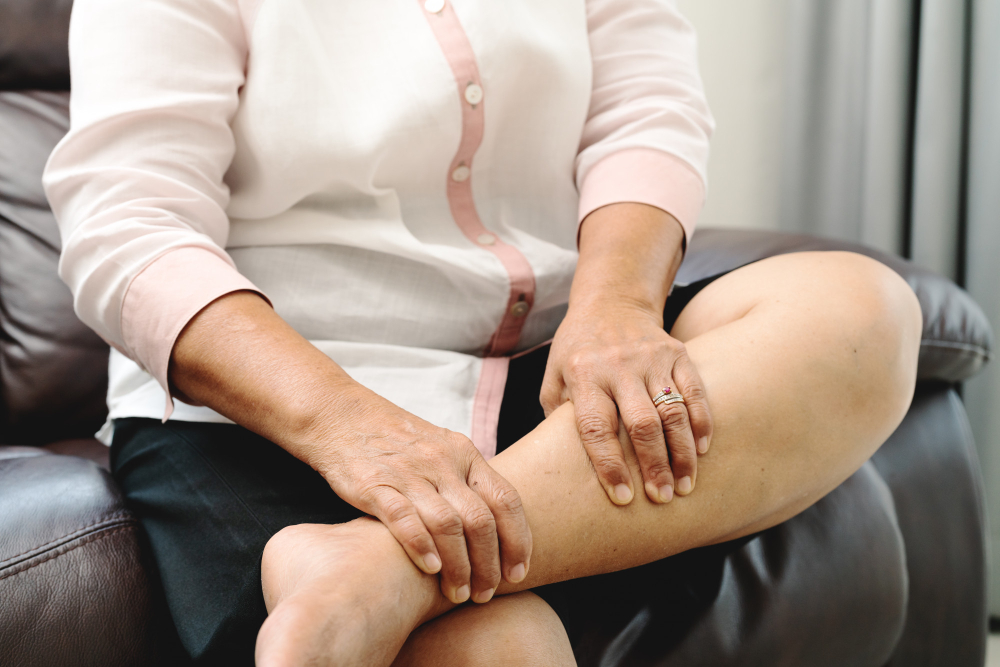 senior-woman-suffering-from-leg-cramp-pain-home